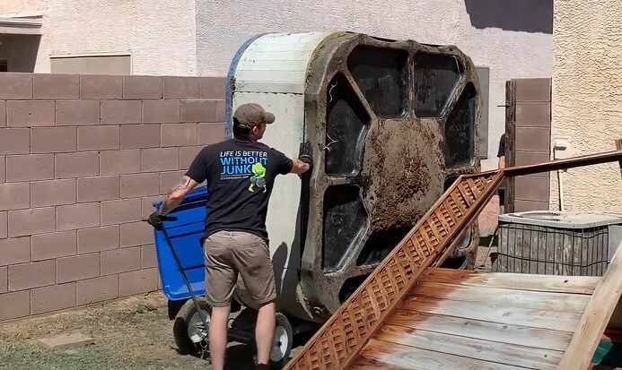 Hot tub hauling and disposal service removing large spa unit